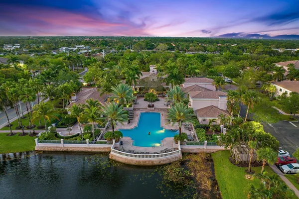 a view of a house with a garden and a lake view