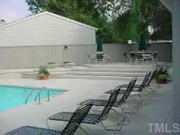 2417 Condor Court Raleigh, NC 27615 - Photo 5 of 10 a backyard of a house with table and chairs