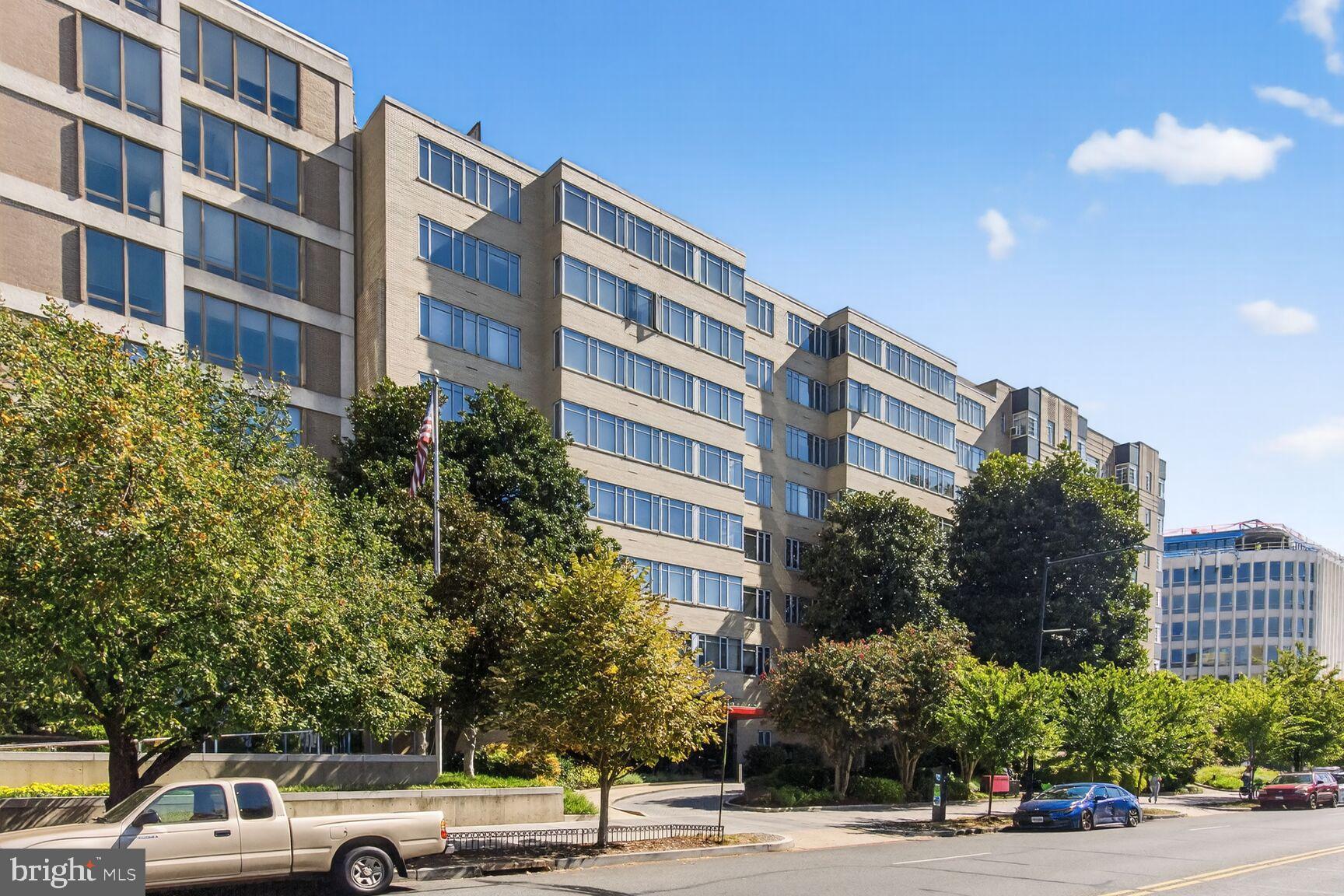 1711 Massachusetts Avenue Northwest, Unit 825 Washington, DC 20036 - Photo 1 of 16 a view of a building and car parked on the roadside