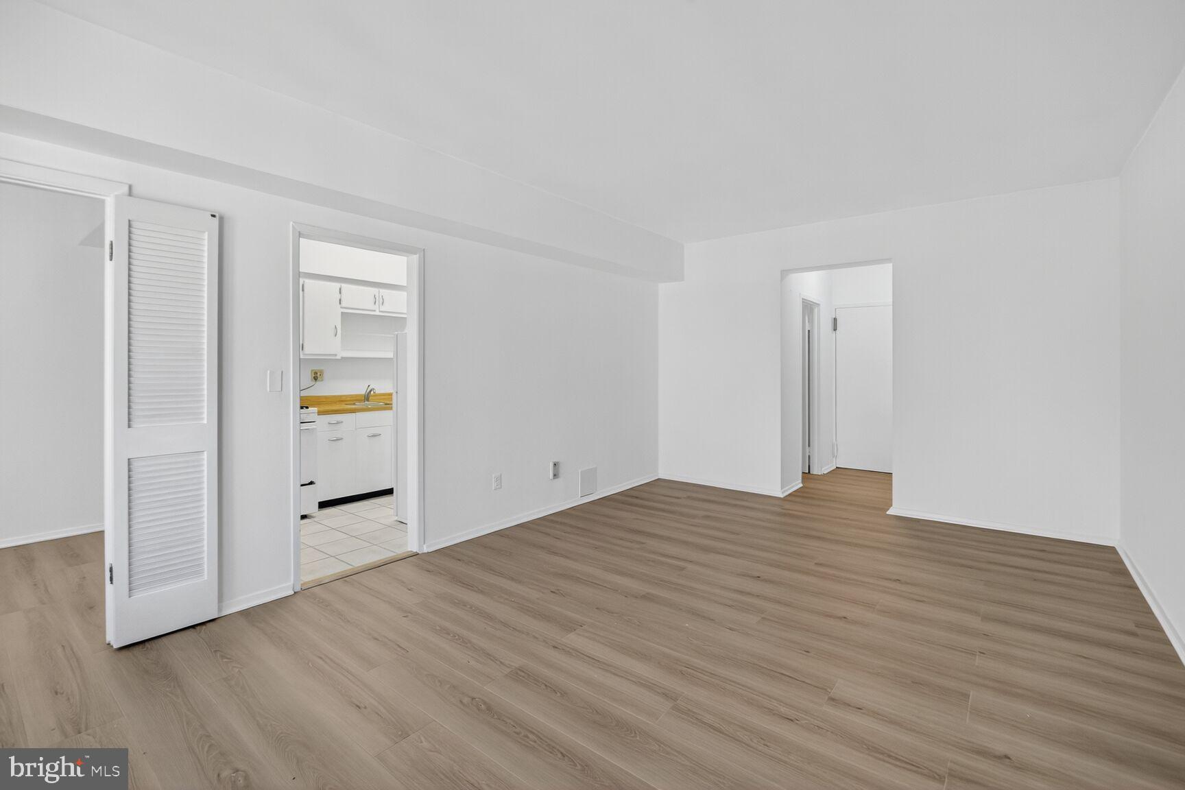 1711 Massachusetts Avenue Northwest, Unit 825 Washington, DC 20036 - Photo 5 of 16 a view of empty room with wooden floor