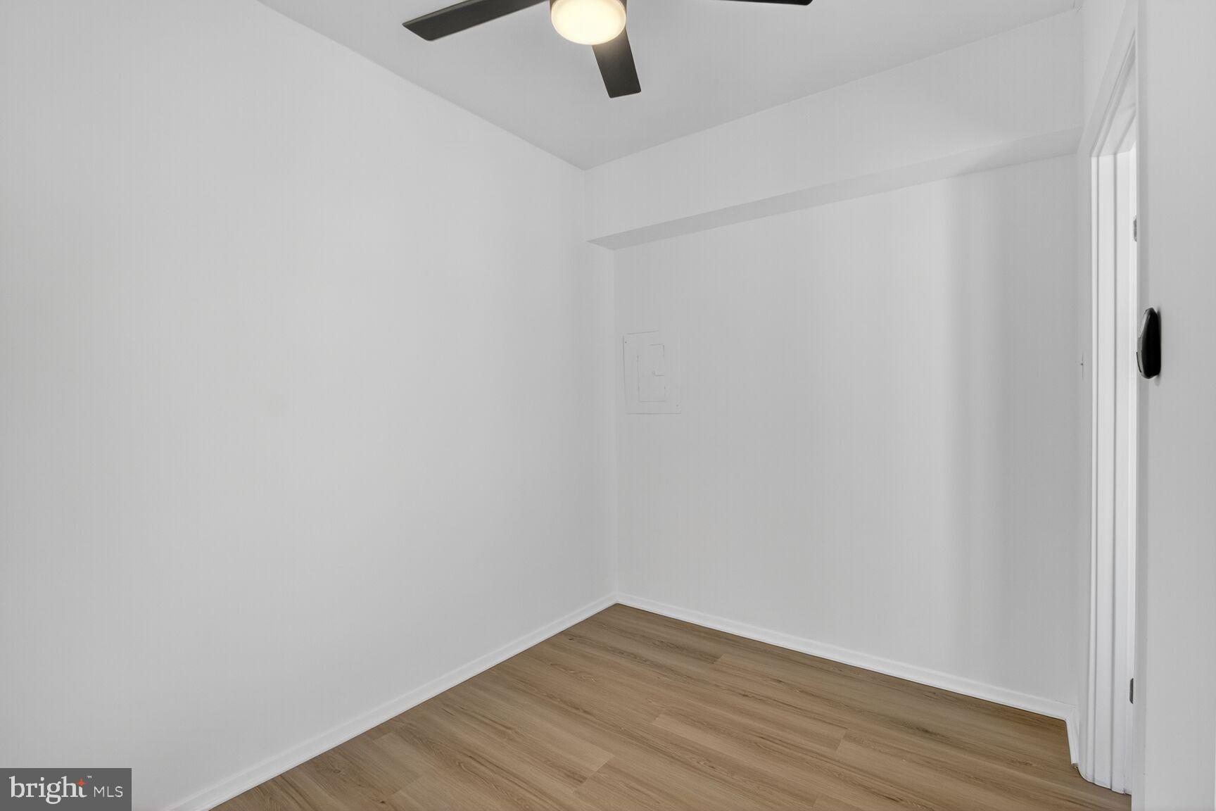 1711 Massachusetts Avenue Northwest, Unit 825 Washington, DC 20036 - Photo 9 of 16 a view of an empty room with wooden floor