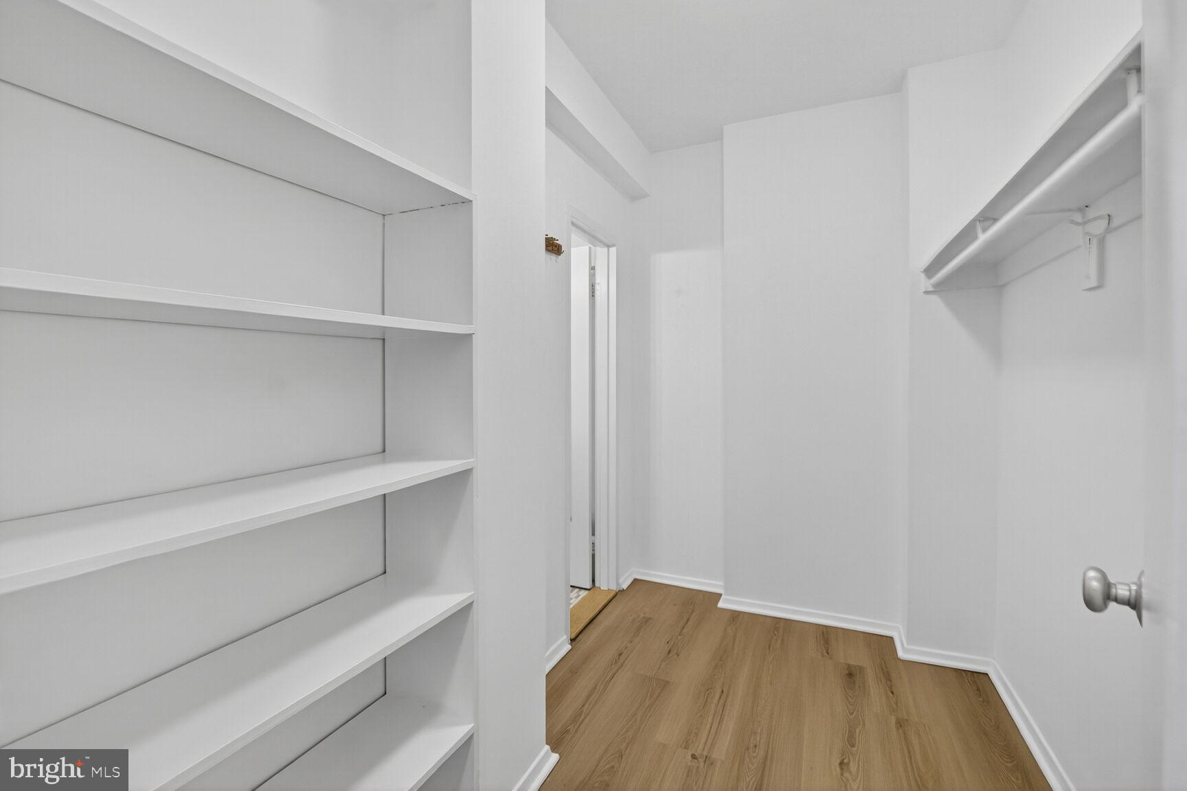 1711 Massachusetts Avenue Northwest, Unit 825 Washington, DC 20036 - Photo 10 of 16 a view of walk in closet with empty racks