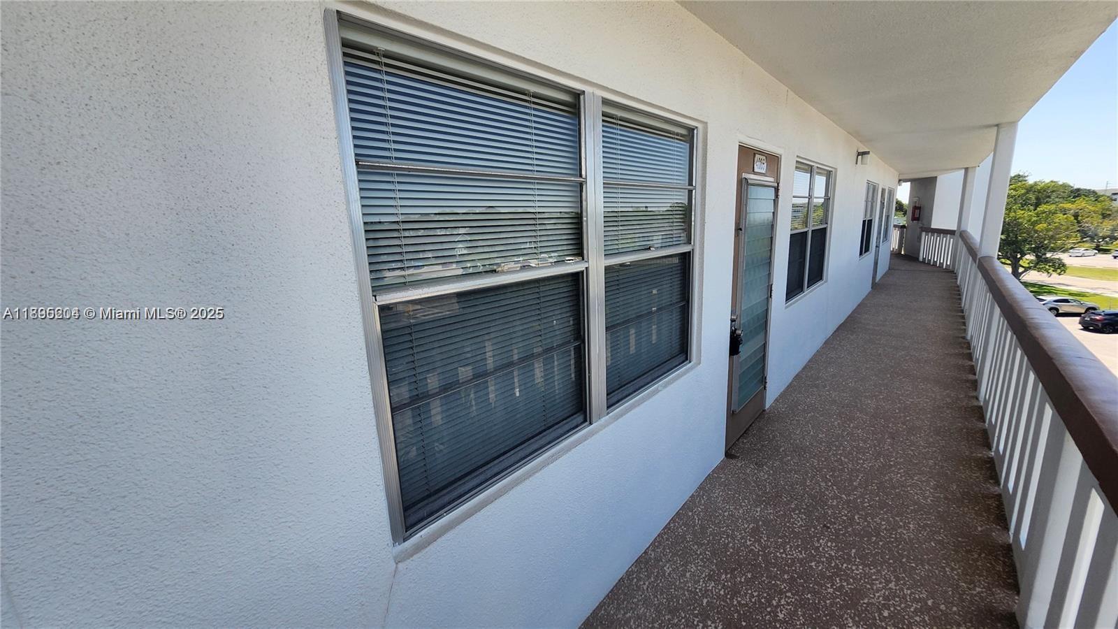 4065 Lyndhurst North, Unit 4065 Deerfield Beach, FL 33442 - Photo 19 of 34 a view of hallway with wooden floor