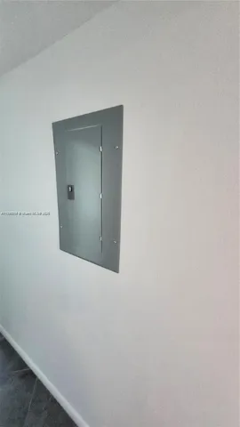 a view of a garden with cars parked