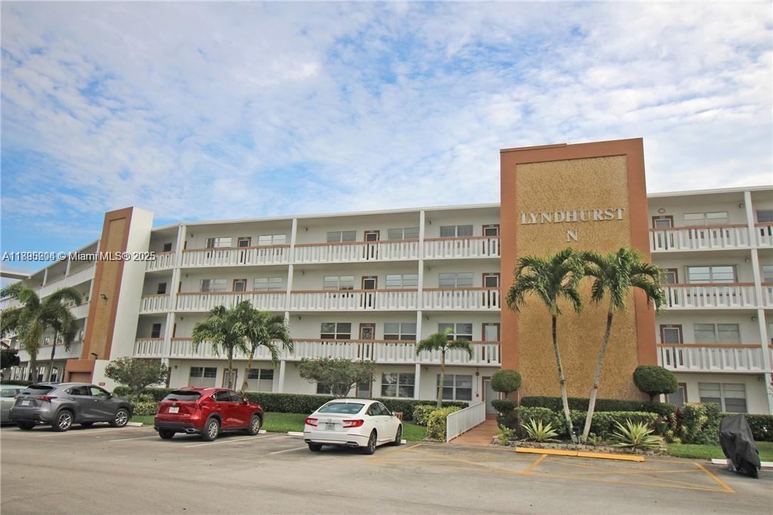 4065 Lyndhurst North, Unit 4065 Deerfield Beach, FL 33442 - Photo 22 of 34 a car parked in front of a building