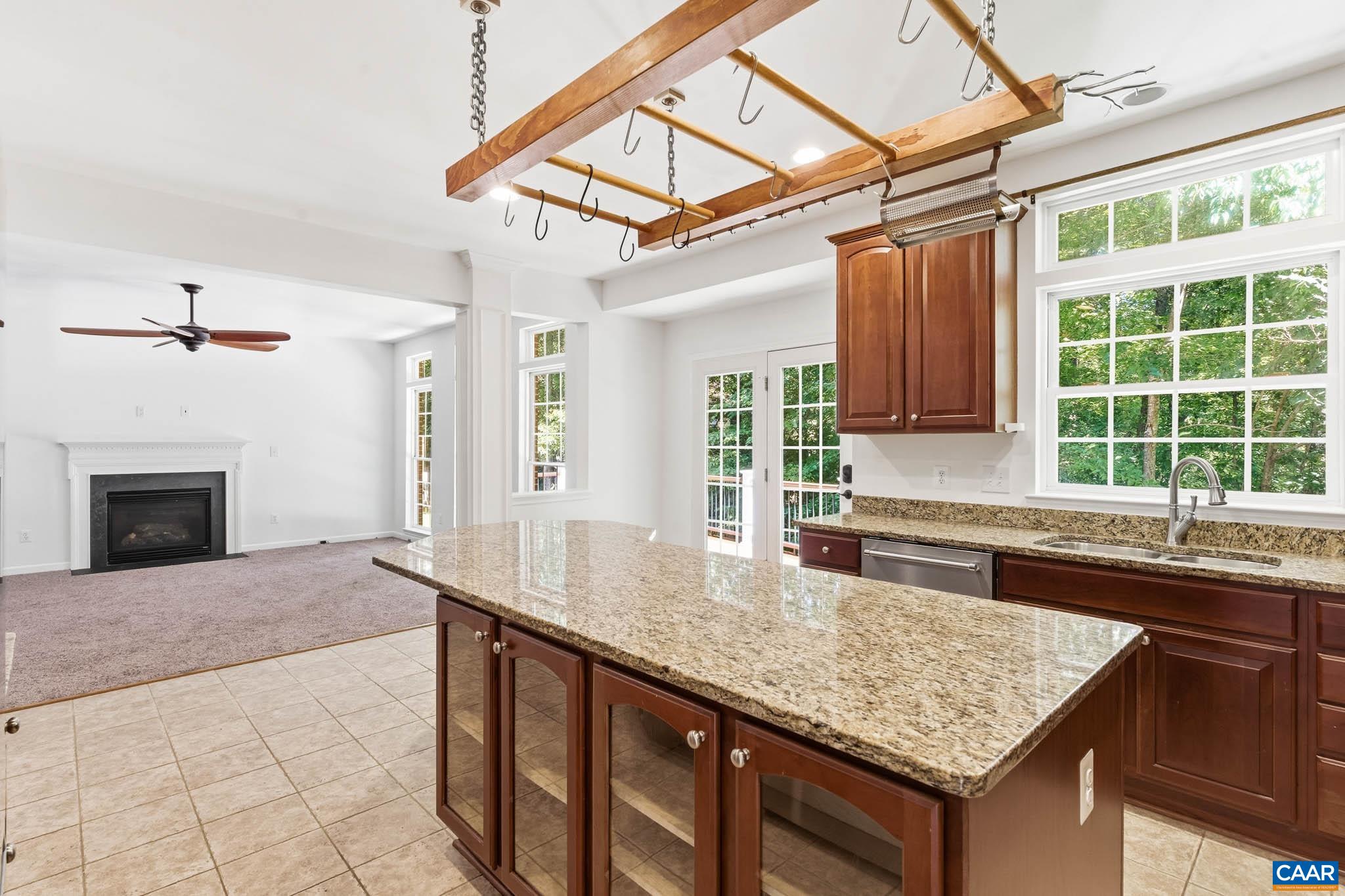 700 Rainier Road Charlottesville, VA 22903 - Photo 11 of 41 The kitchen opens into the main family room and rear outdoor living areas.