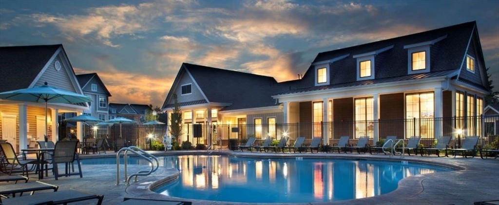 a view of a chairs and table in a patio