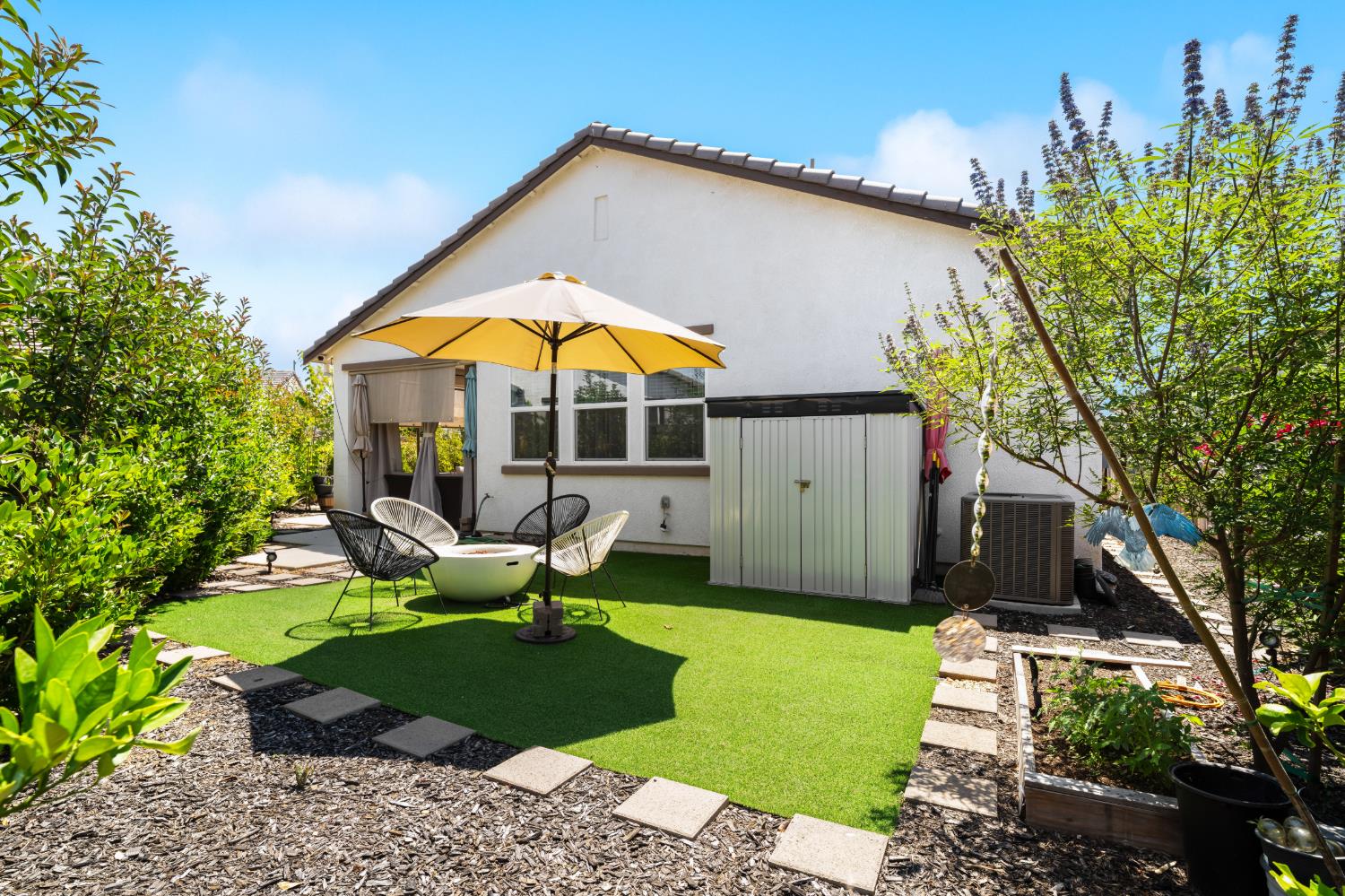 4216 Creede Way Rancho Cordova, CA 95742 - Photo 51 of 56 a view of a house with backyard sitting area and garden