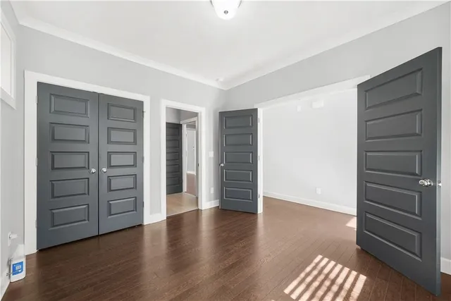 a view of an empty room with a closet