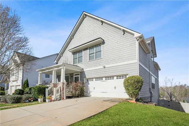 a front view of a house with a yard
