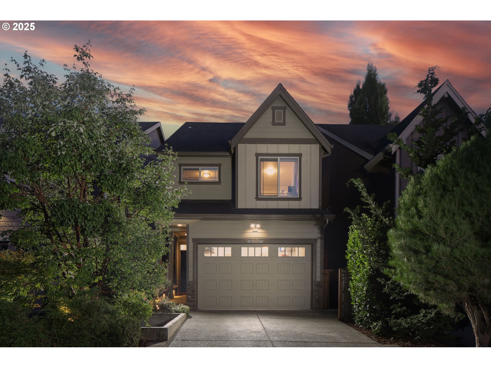 8826 Southwest Spruce Street Portland, OR 97223 - Photo 1 of 34 a front view of a house with a yard