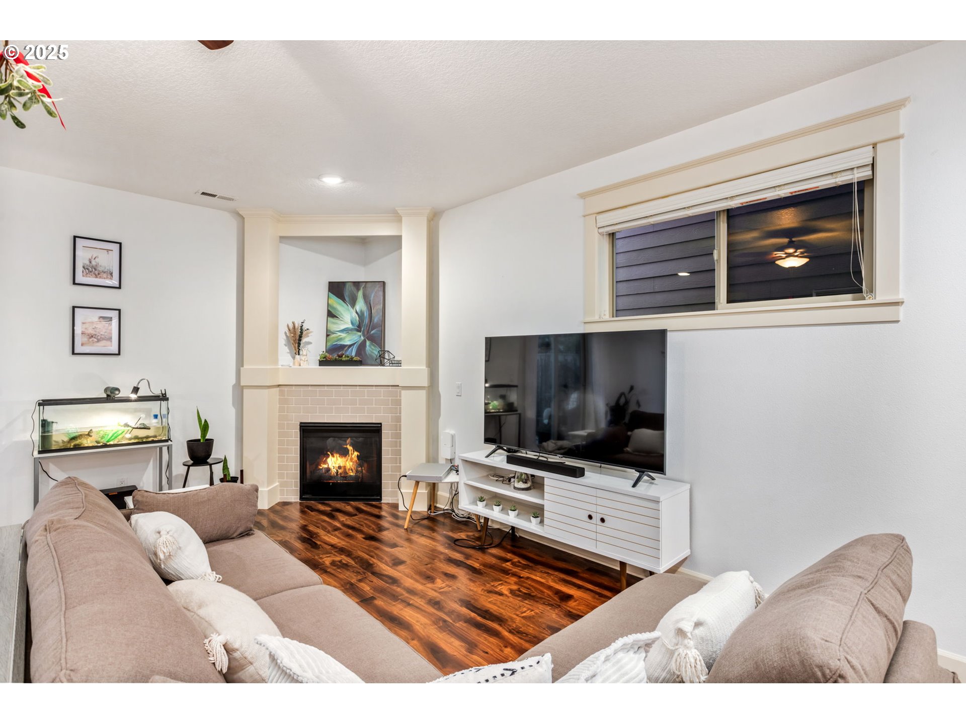 8826 Southwest Spruce Street Portland, OR 97223 - Photo 11 of 34 a living room with furniture and a fireplace