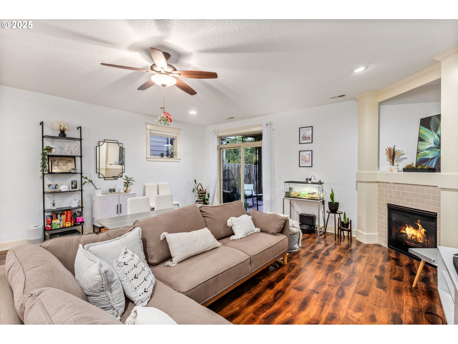 8826 Southwest Spruce Street Portland, OR 97223 - Photo 12 of 34 a living room with furniture and a fireplace
