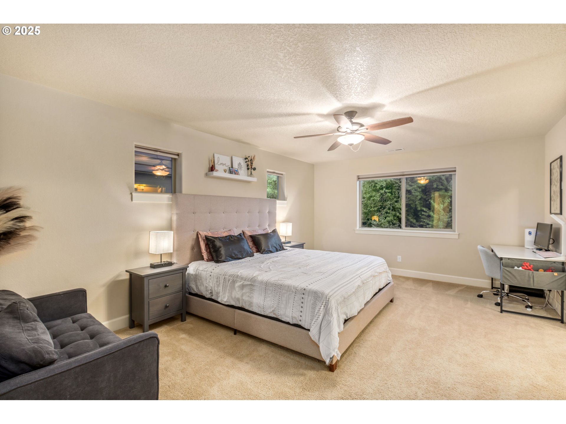 8826 Southwest Spruce Street Portland, OR 97223 - Photo 13 of 34 a living room with a bed furniture and a window