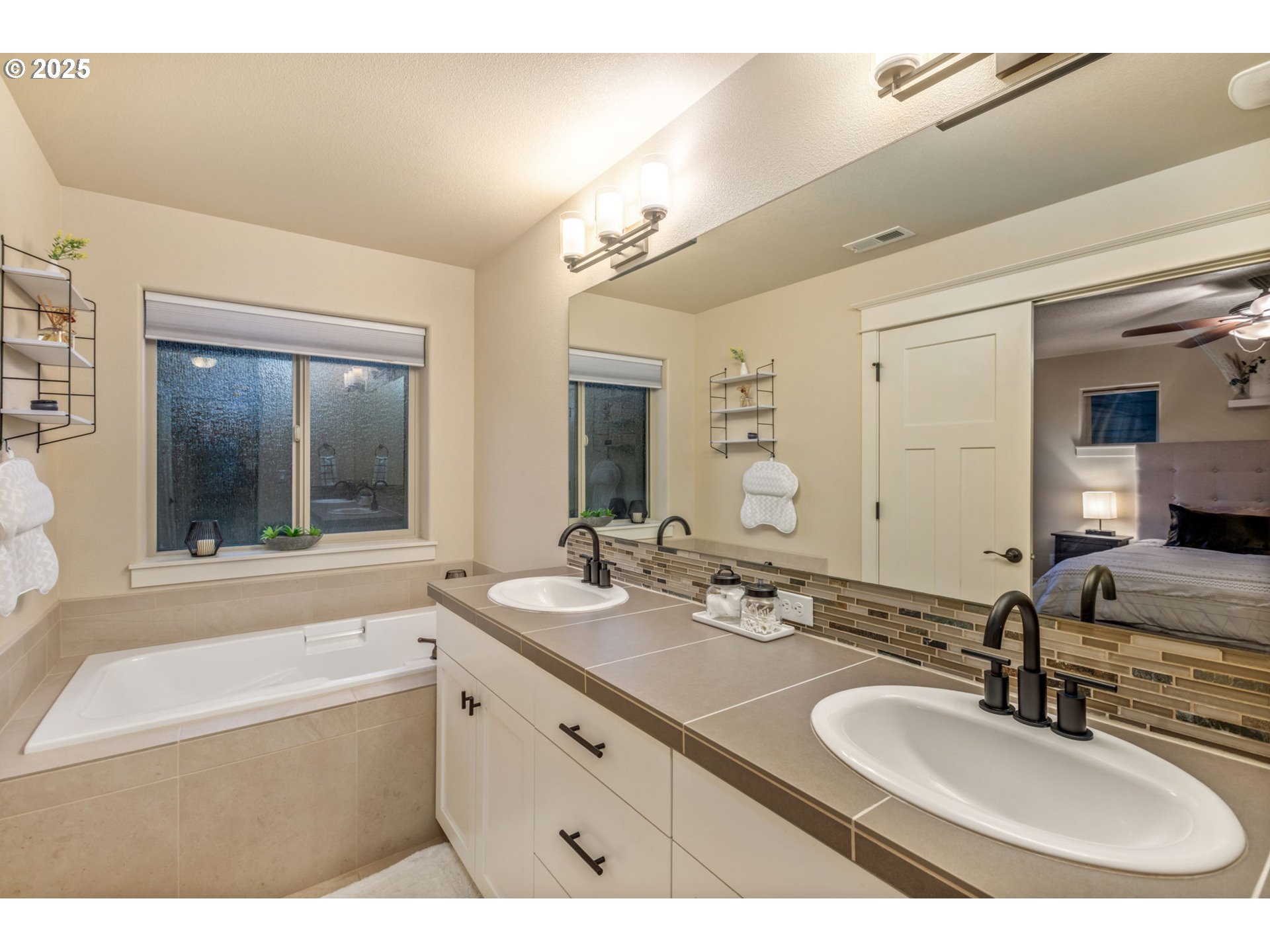 8826 Southwest Spruce Street Portland, OR 97223 - Photo 16 of 34 a bathroom with a sink and a mirror