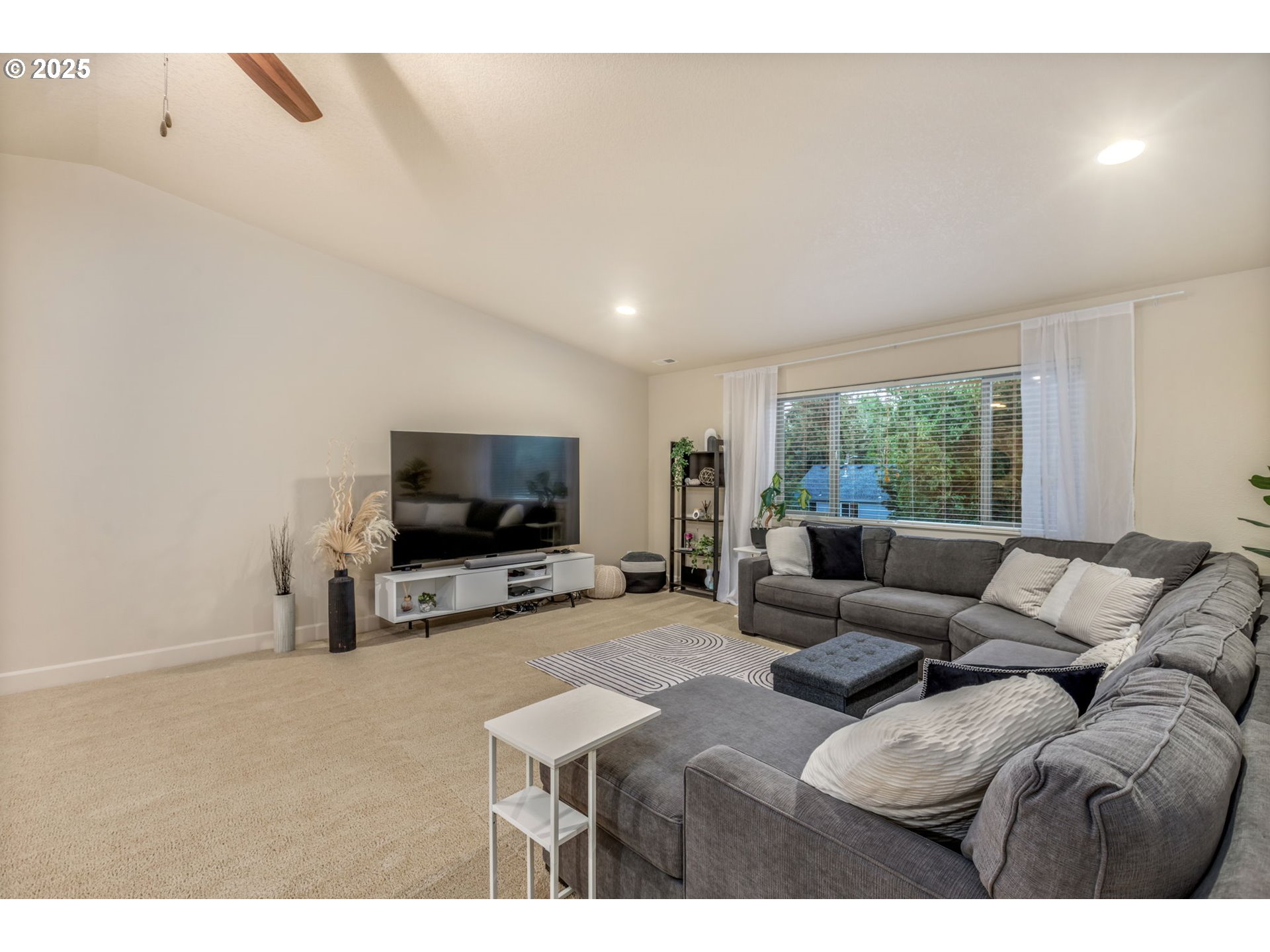 8826 Southwest Spruce Street Portland, OR 97223 - Photo 18 of 34 a living room with furniture and a flat screen tv