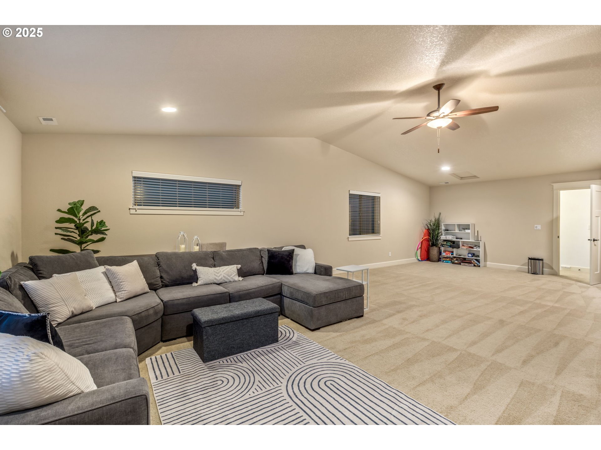 8826 Southwest Spruce Street Portland, OR 97223 - Photo 20 of 34 a living room with furniture a ceiling fan and a window