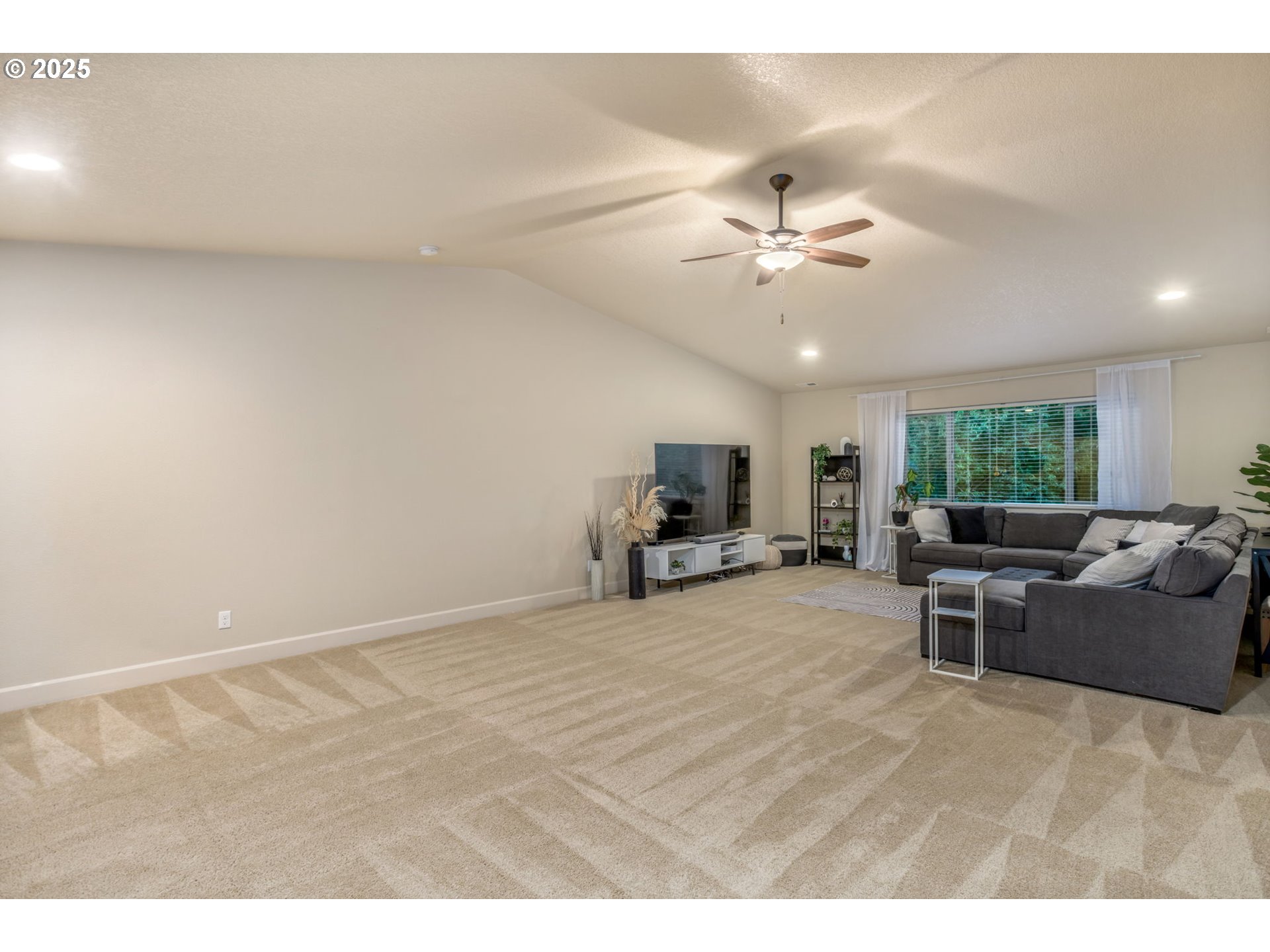 8826 Southwest Spruce Street Portland, OR 97223 - Photo 21 of 34 a view of a livingroom with furniture and a flat screen tv