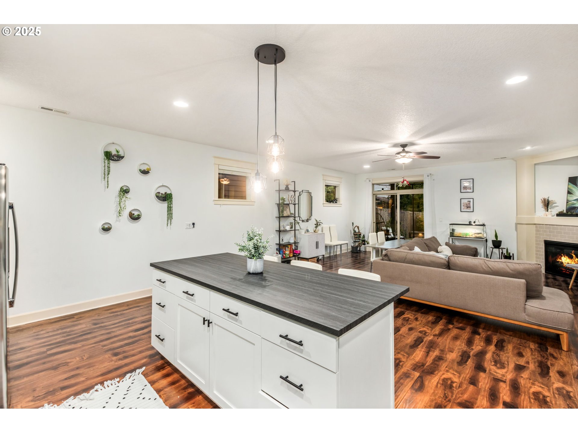 8826 Southwest Spruce Street Portland, OR 97223 - Photo 8 of 34 a view of living room with granite countertop furniture and fireplace