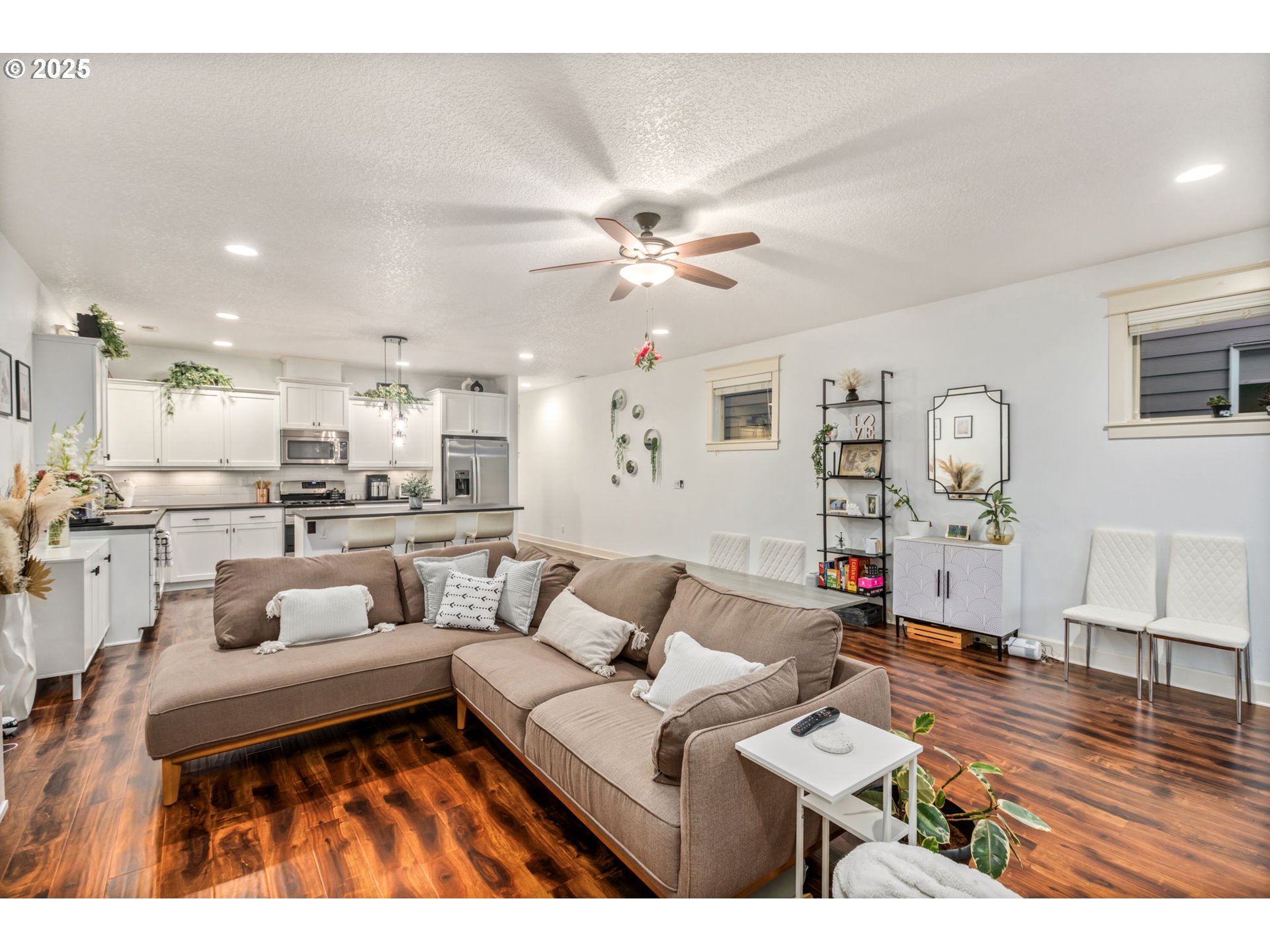 8826 Southwest Spruce Street Portland, OR 97223 - Photo 9 of 34 a living room with furniture and kitchen view