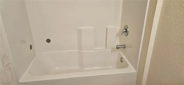 a close view of a bathtub in a bathroom