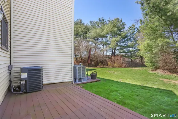 a view of a backyard with large trees