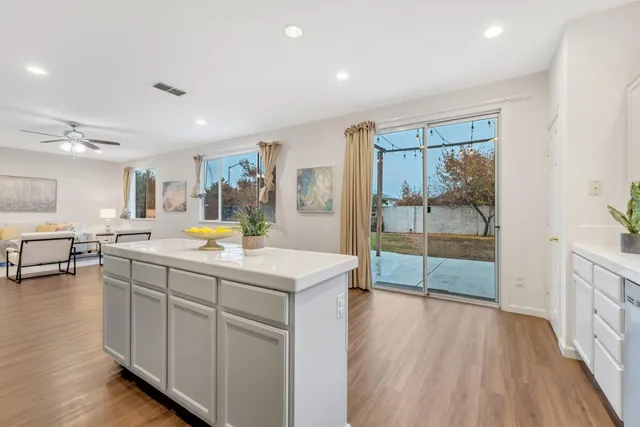 a bathroom with a sink a mirror and a bath tub