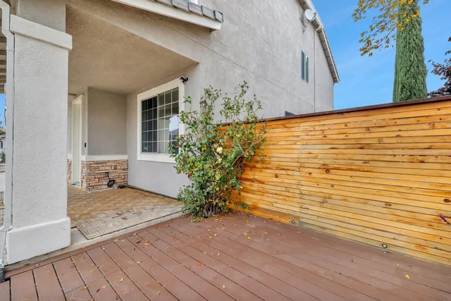 a view of front door and potted plants