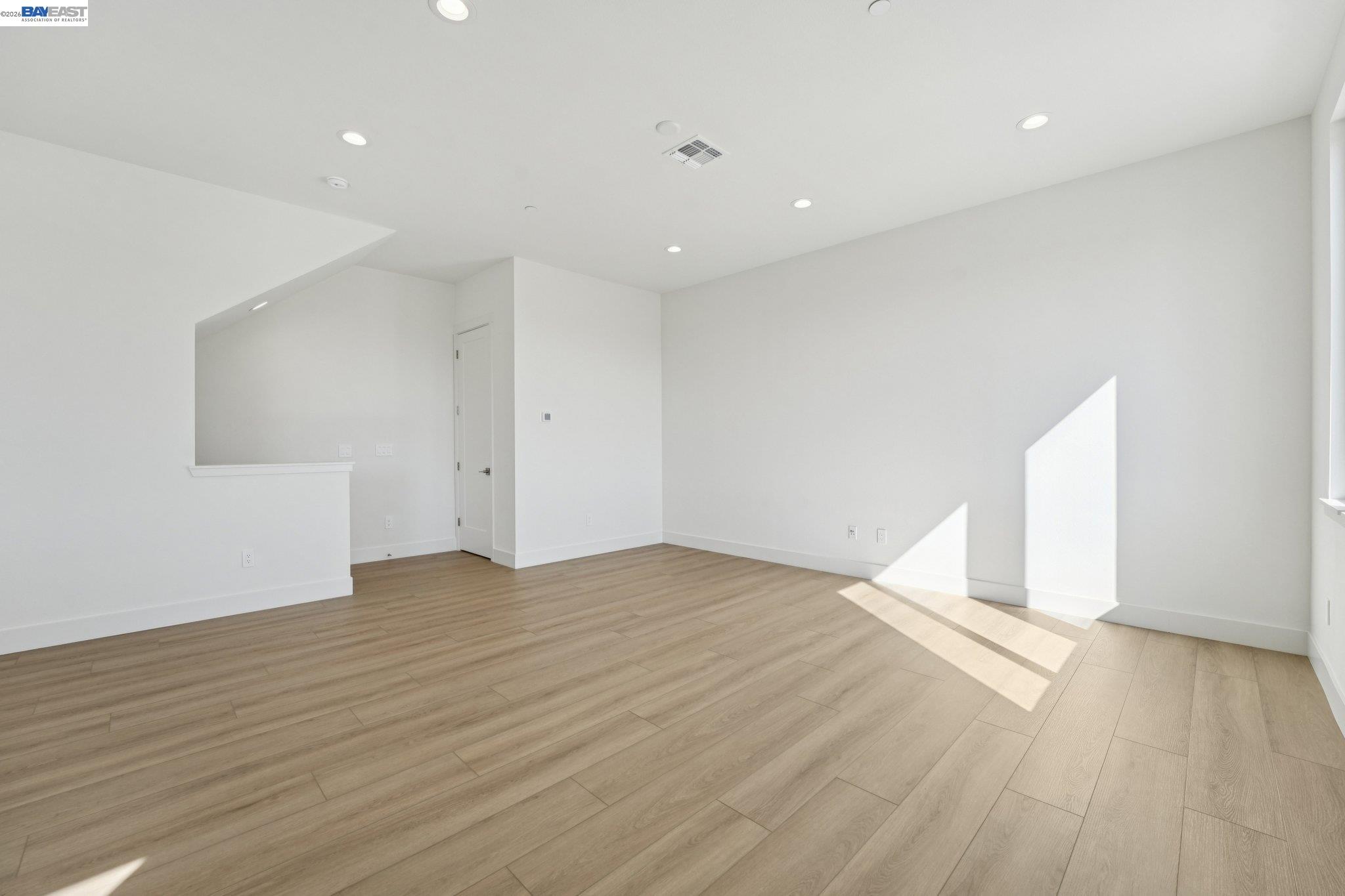 1933 Grand Street Alameda, CA 94501 - Photo 12 of 50 a view of empty room with wooden floor