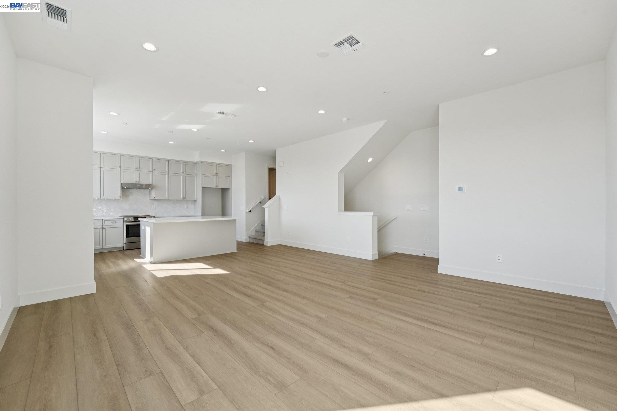 1933 Grand Street Alameda, CA 94501 - Photo 13 of 50 a view of kitchen with wooden floor and electronic appliances