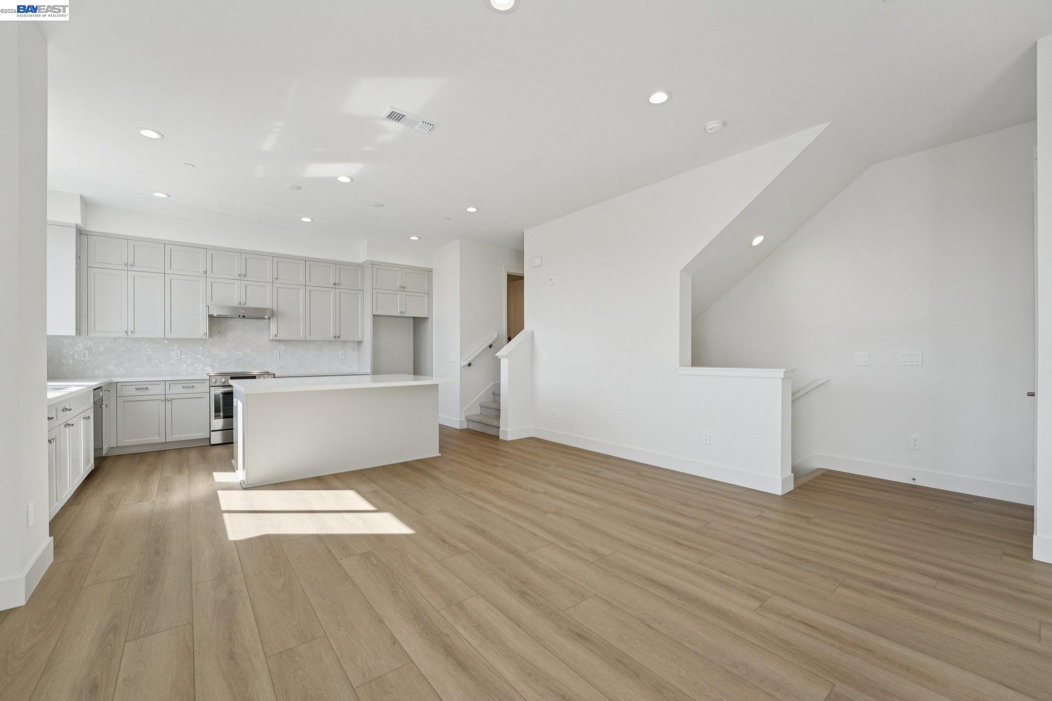 1933 Grand Street Alameda, CA 94501 - Photo 14 of 50 a view of kitchen with wooden floor and electronic appliances