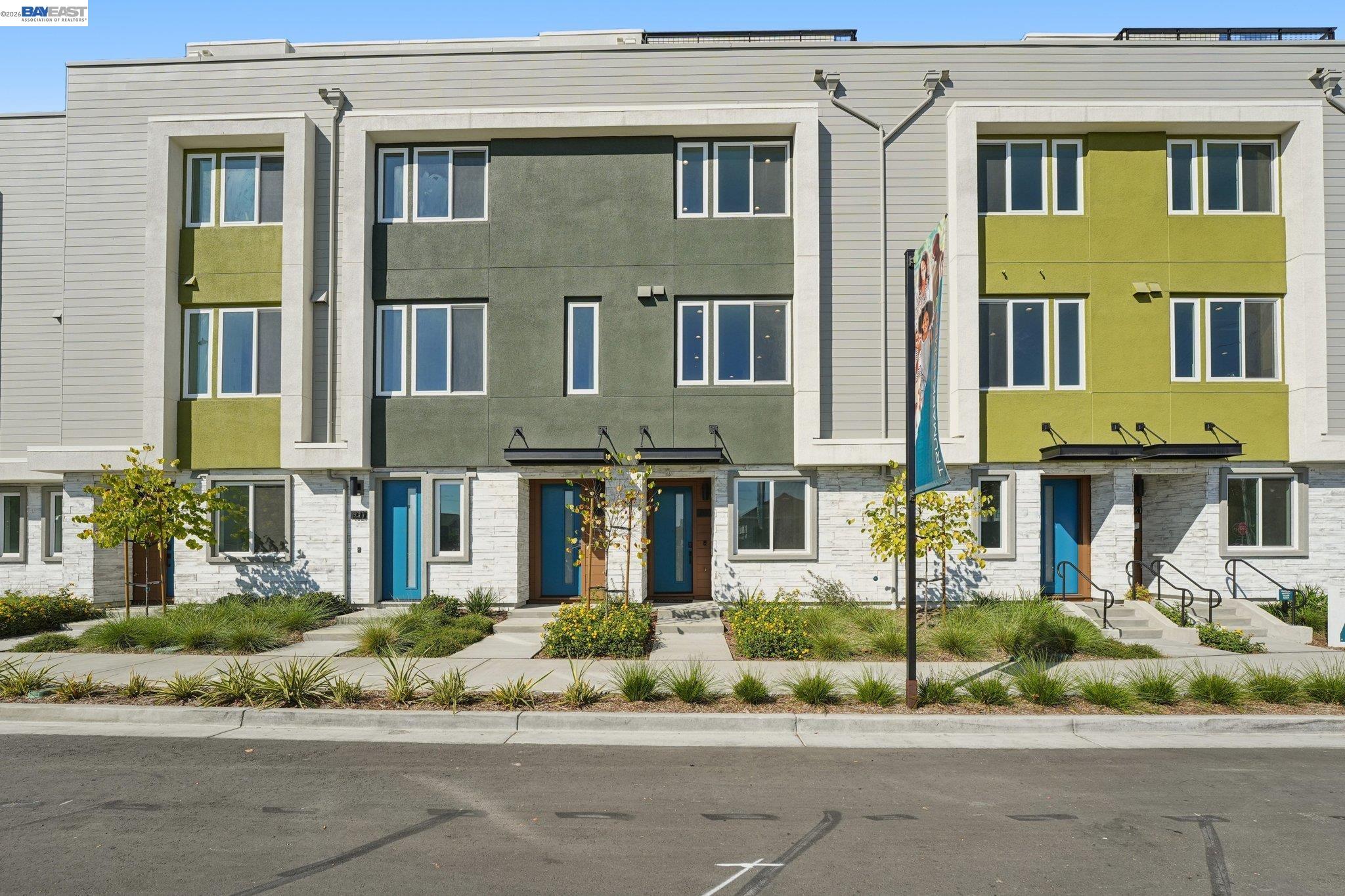1933 Grand Street Alameda, CA 94501 - Photo 2 of 50 a front view of a residential apartment building with a yard