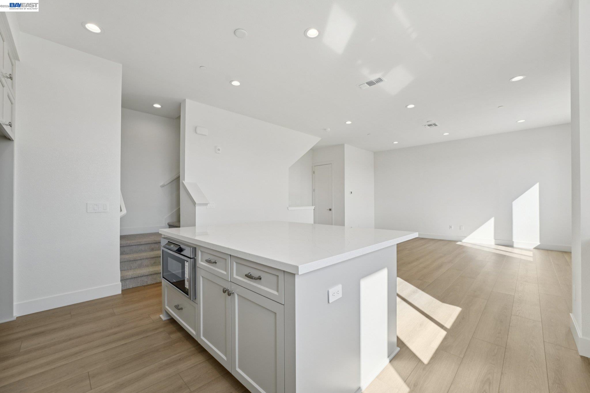 1933 Grand Street Alameda, CA 94501 - Photo 21 of 50 a kitchen with stainless steel appliances a stove and a refrigerator