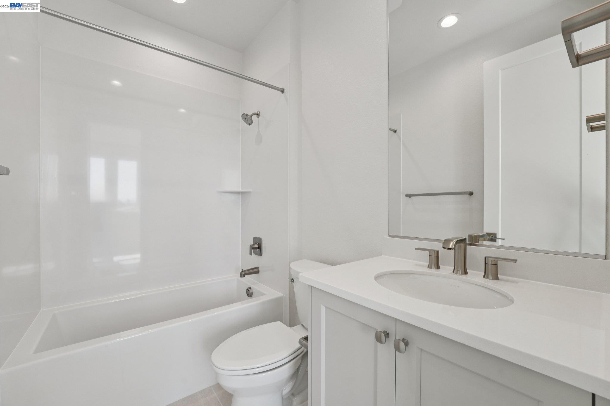 1933 Grand Street Alameda, CA 94501 - Photo 38 of 50 a bathroom with a sink toilet vanity and shower