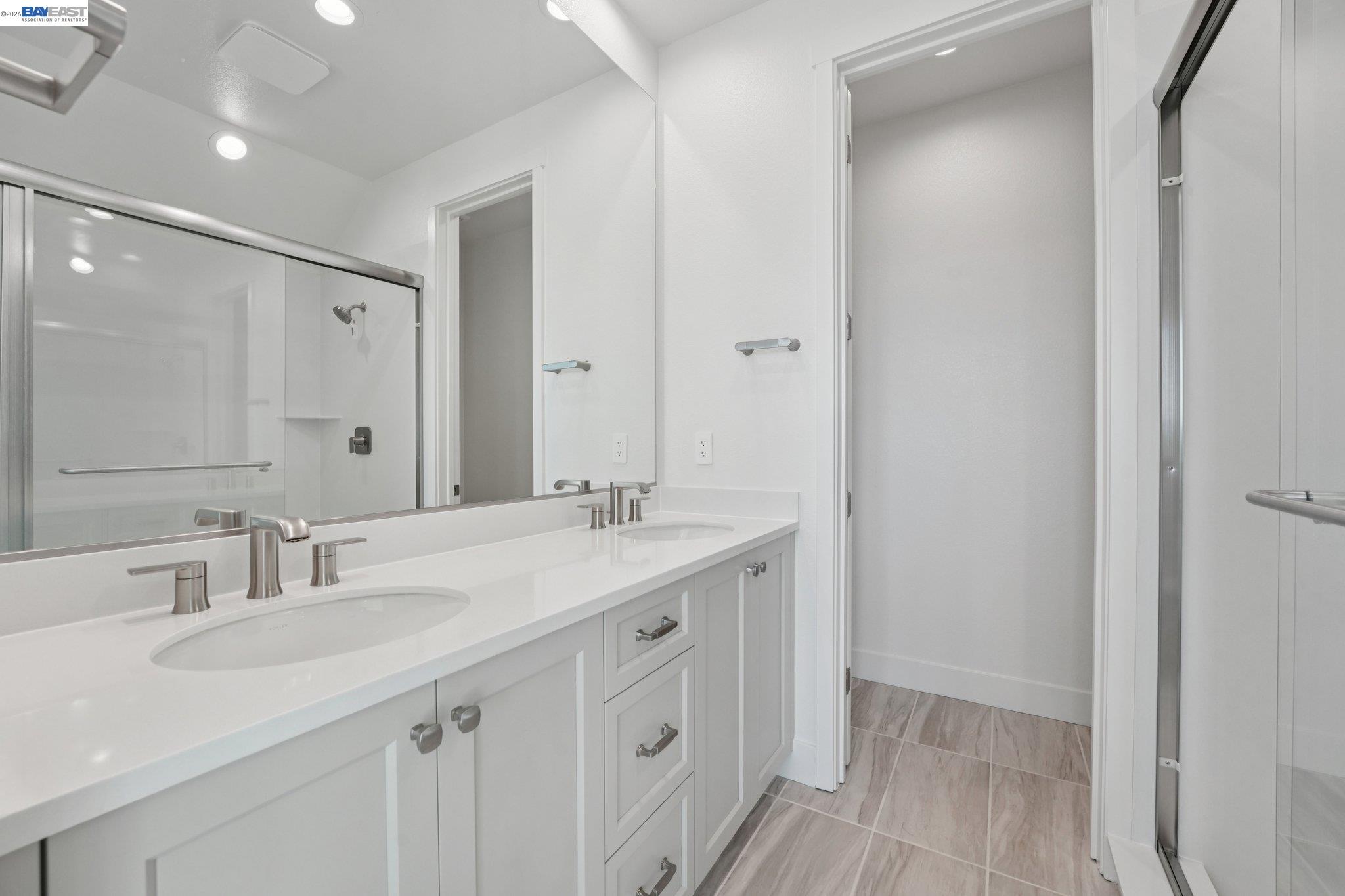1933 Grand Street Alameda, CA 94501 - Photo 45 of 50 a bathroom with a sink double vanity and a mirror