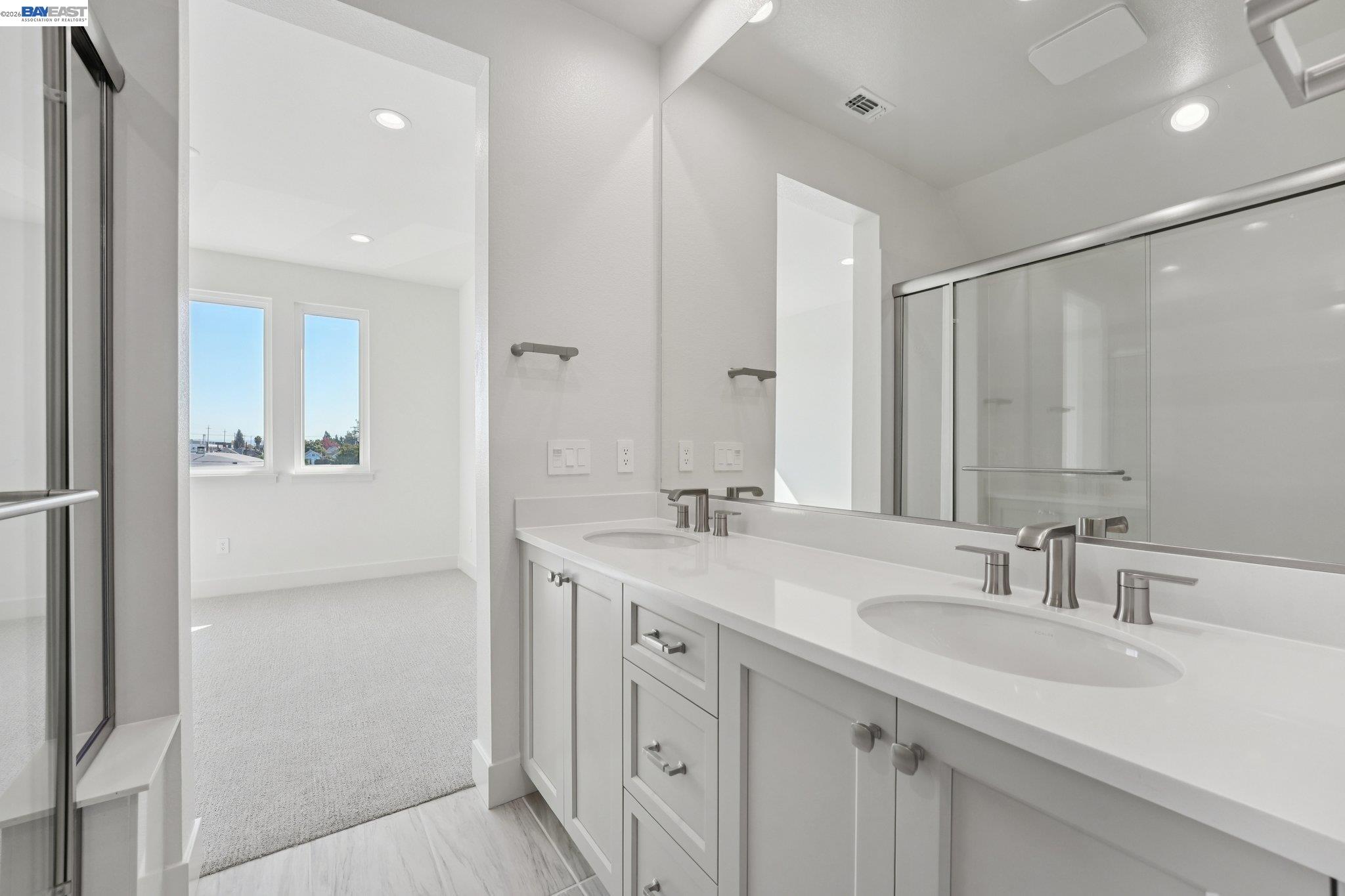 1933 Grand Street Alameda, CA 94501 - Photo 46 of 50 a bathroom with a sink double vanity and a mirror