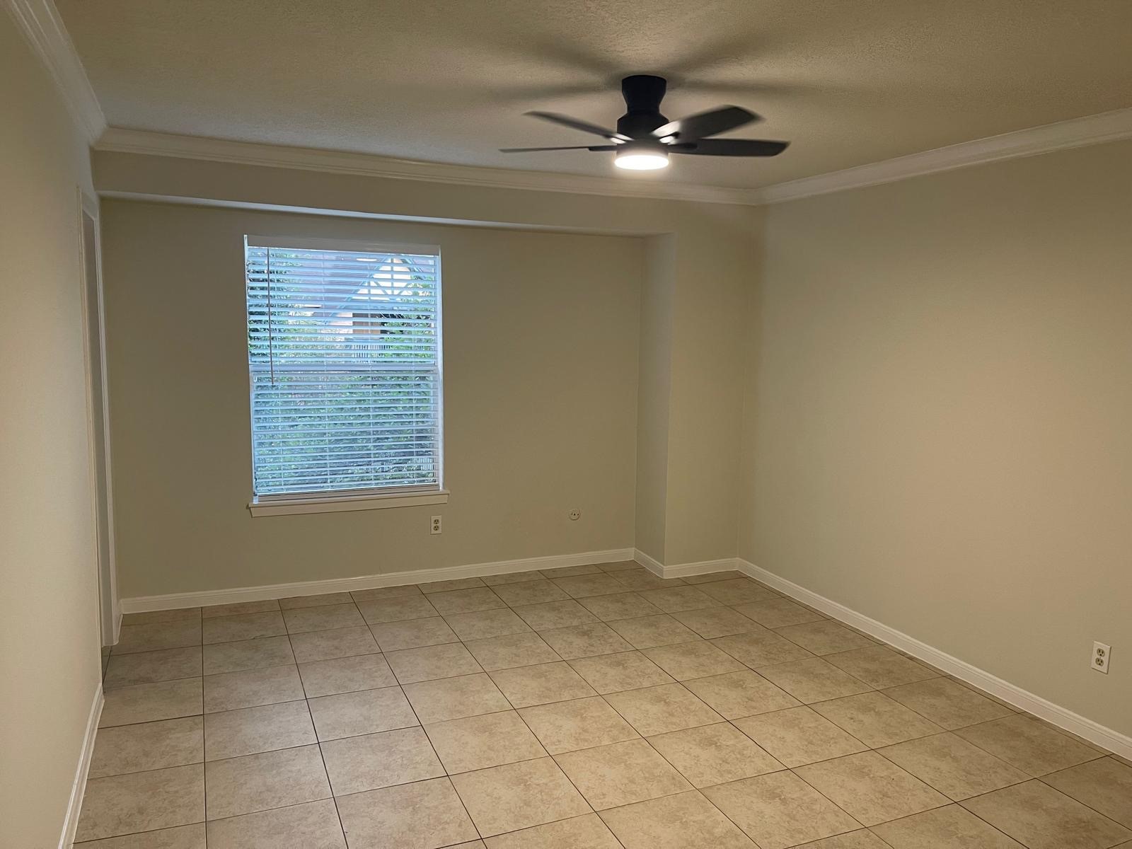 8229 Kingsbrook Road, Unit 228 Houston, TX 77024 - Photo 11 of 17 a view of an empty room with a window