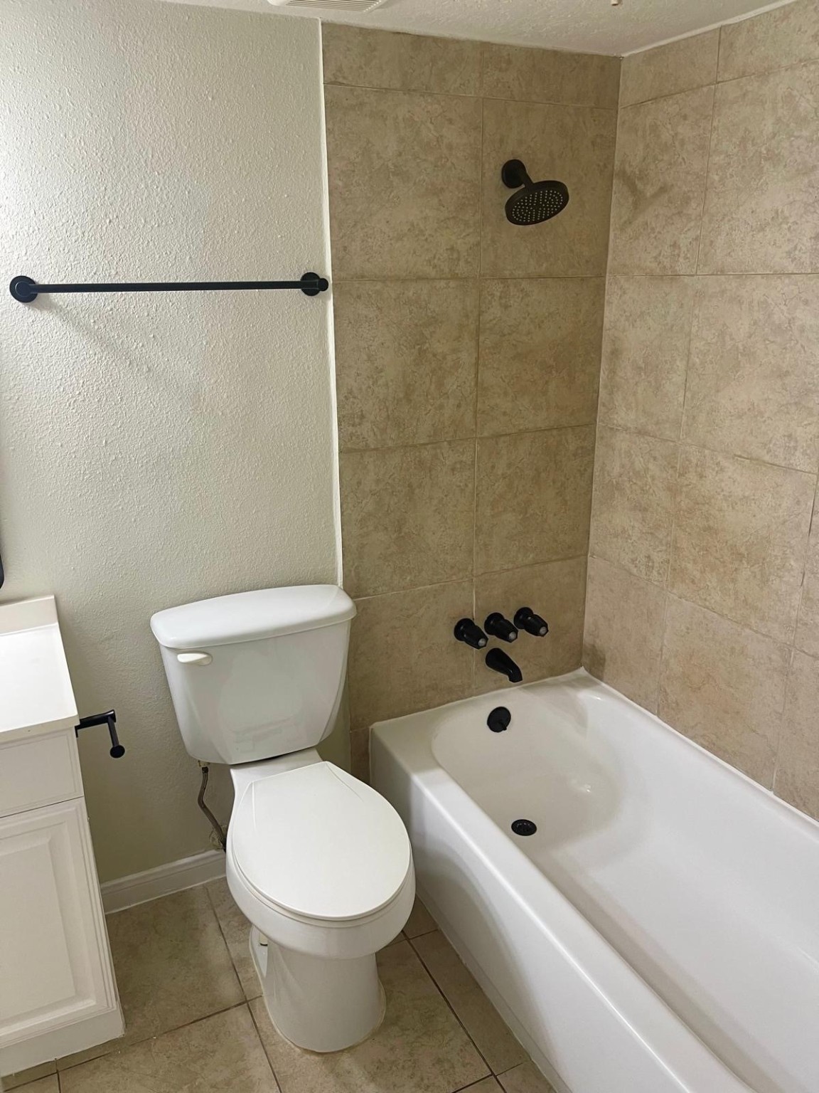 8229 Kingsbrook Road, Unit 228 Houston, TX 77024 - Photo 8 of 17 a white toilet sitting next to a bath tub