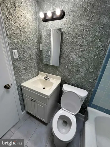 a bathroom with a sink and a toilet
