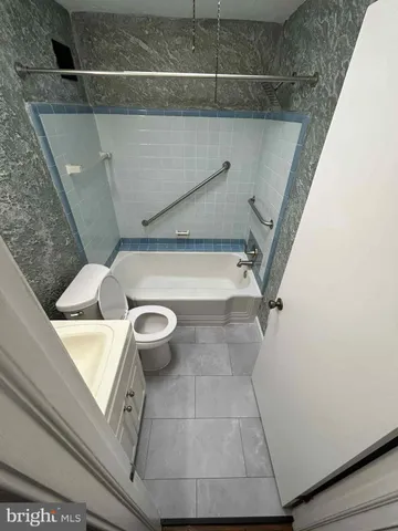 a bathroom with a sink and toilet