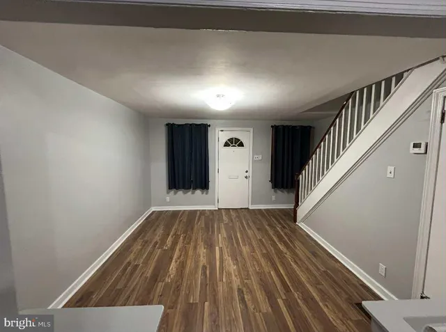 a view of entryway with wooden floor