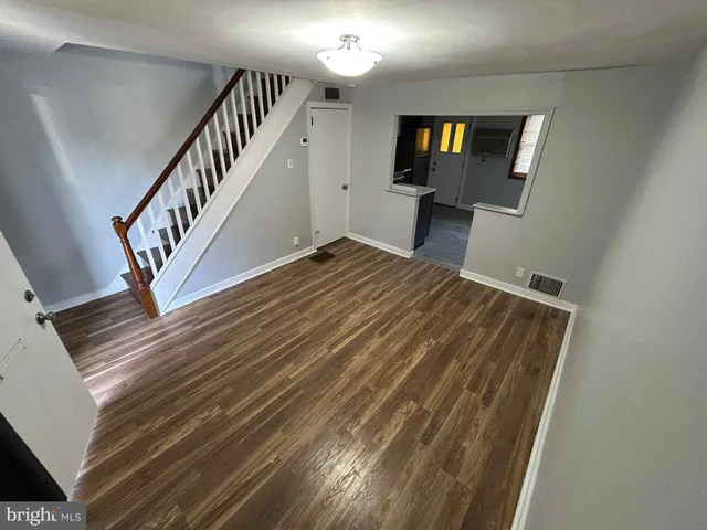 a view of staircase with wooden floor and stairs