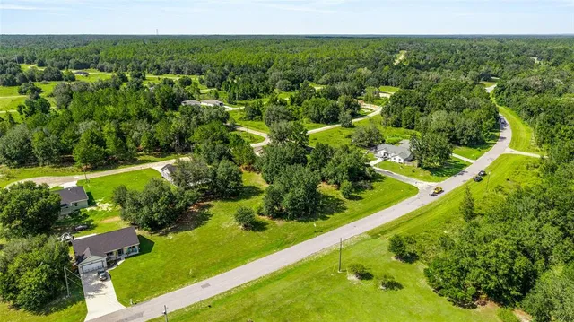 a view of a garden with a building in the background
