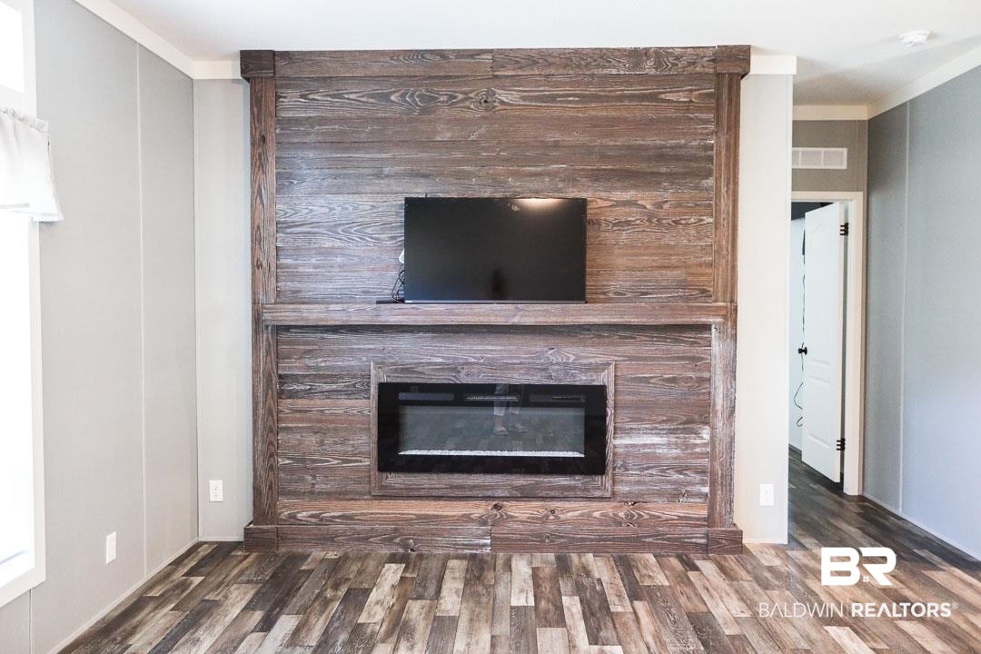 19180 Horseshoe Circle Seminole, AL 36574 - Photo 5 of 38 Detailed view of a fireplace, wood finished floors, and ornamental molding