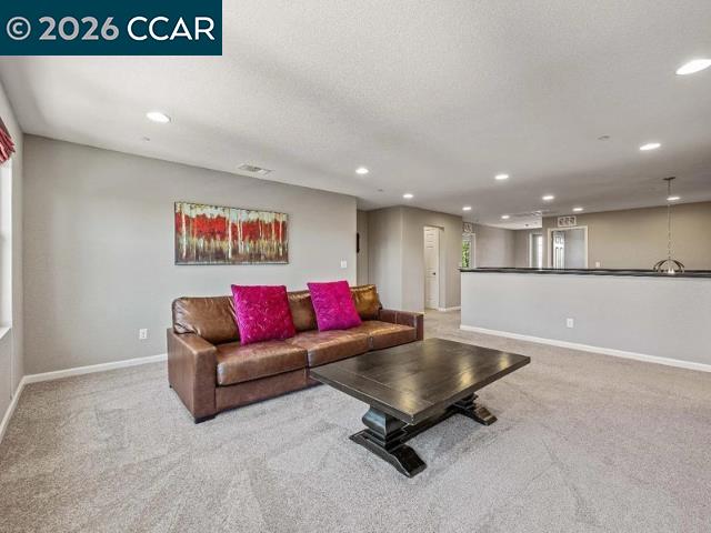 5525 Mossy Stone Way Rancho Cordova, CA 95742 - Photo 13 of 31 a living room with furniture and a table