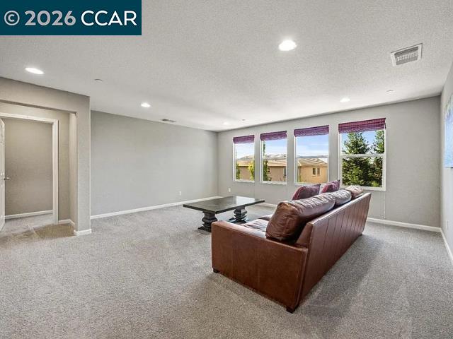 5525 Mossy Stone Way Rancho Cordova, CA 95742 - Photo 14 of 31 a living room with furniture and a large window