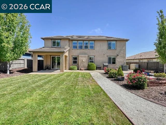 5525 Mossy Stone Way Rancho Cordova, CA 95742 - Photo 20 of 31 a front view of a house with a garden