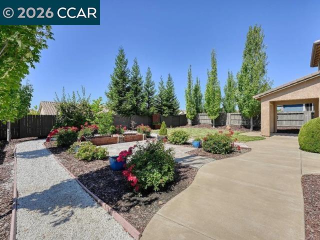 5525 Mossy Stone Way Rancho Cordova, CA 95742 - Photo 24 of 31 a front view of a house with a yard