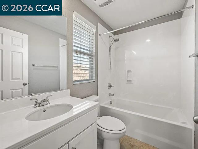 5525 Mossy Stone Way Rancho Cordova, CA 95742 - Photo 27 of 31 a bathroom with a sink a toilet and a bathtub