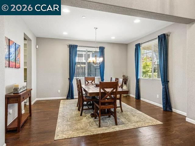 5525 Mossy Stone Way Rancho Cordova, CA 95742 - Photo 3 of 31 a view of a dining room with furniture and wooden floor